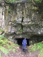 An intrepid caver emerges from Yordas Cave