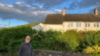 Mike outside his childhood home